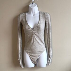 Chic Beige Ribbed Long Sleeve Bodysuit